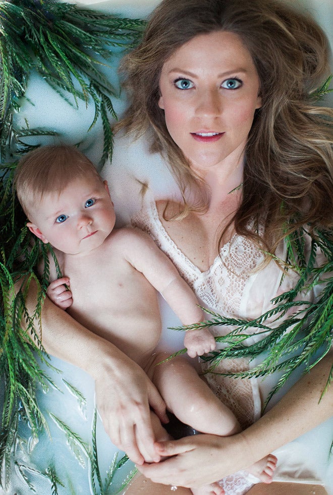 mother and baby in a milk bath with plants