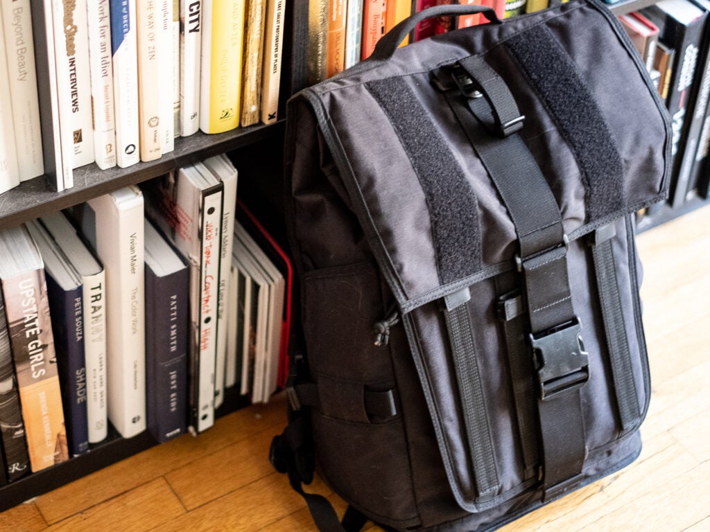mission workshop backpack against bookshelf