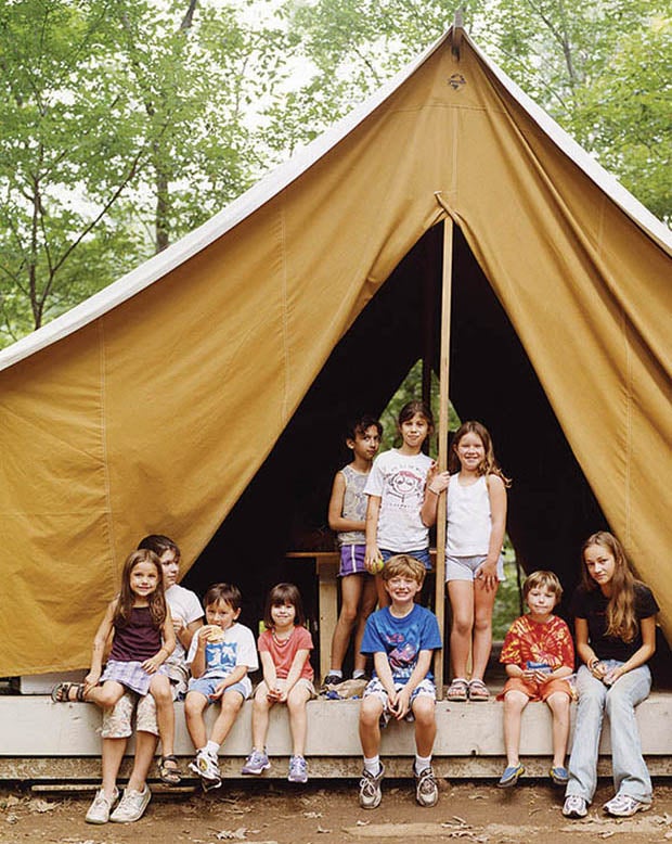 children posing in large tent