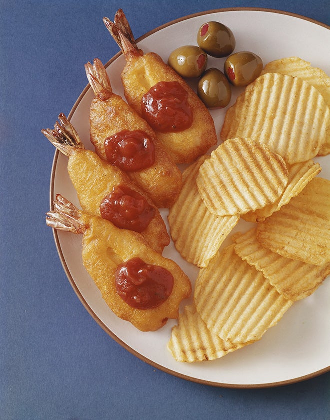 Deep fried battered prawns with tomato sauce, green olives and chips