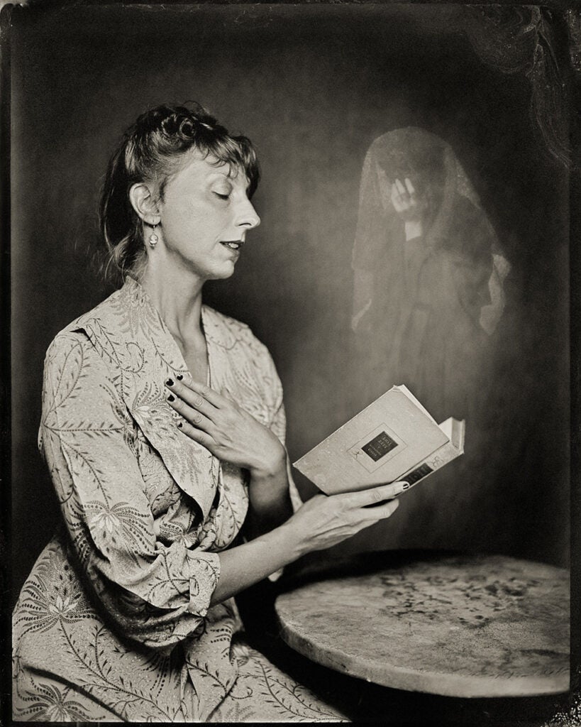 woman reading possessed book