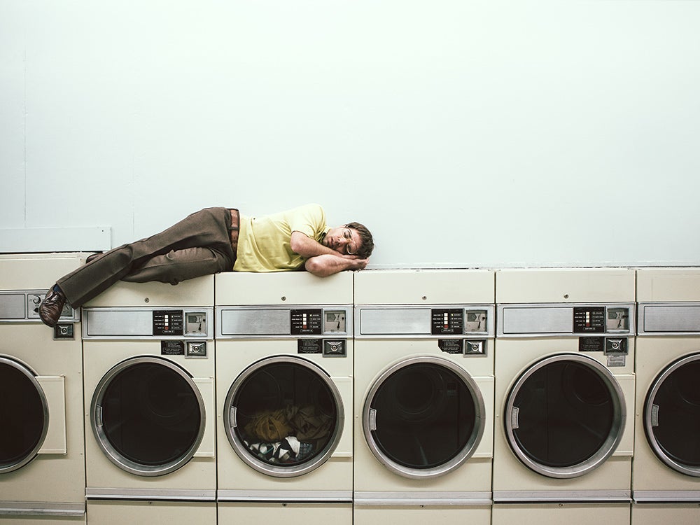Man Sleeping at Laundromat
