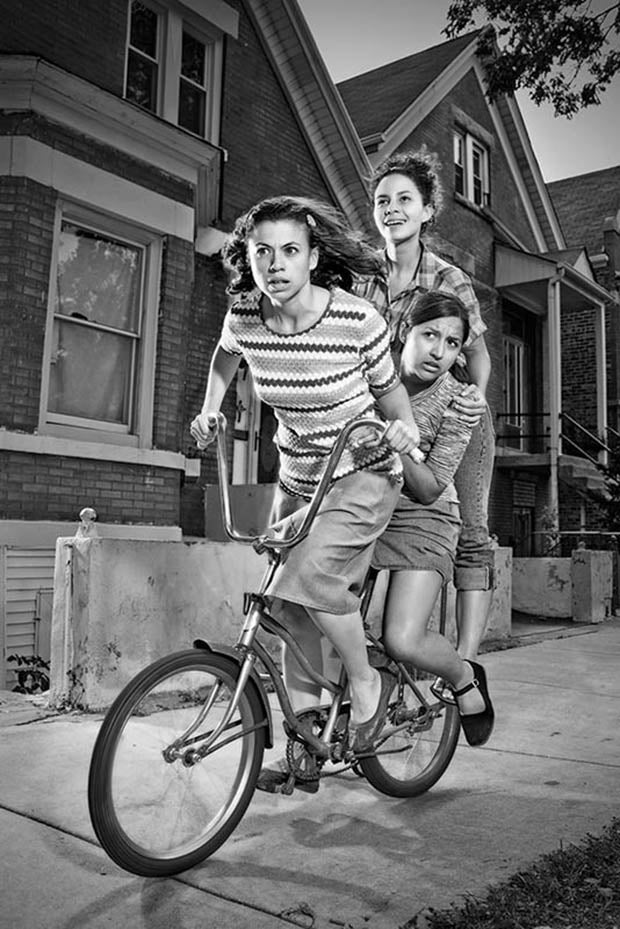 three girls riding one bike