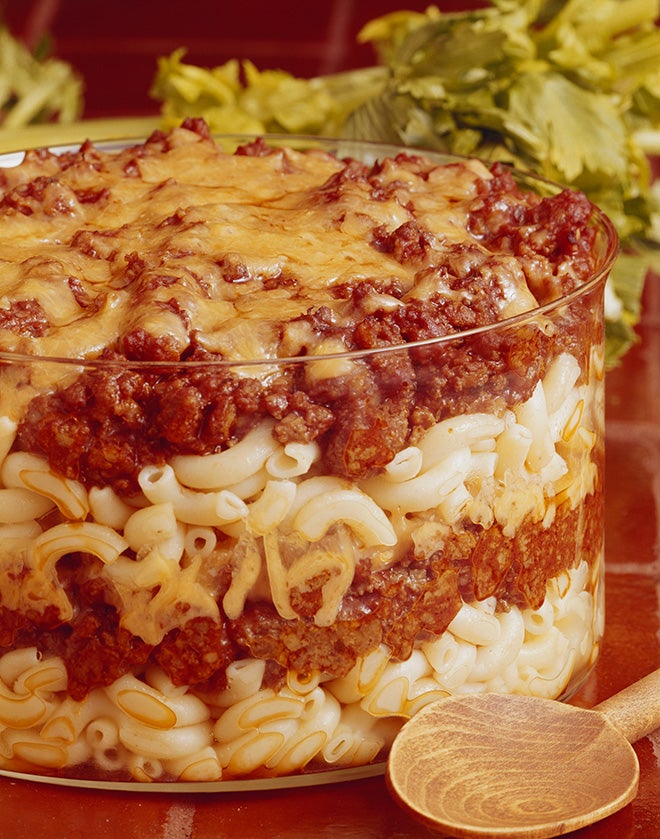 Macaroni pasta layered with meat in bowl