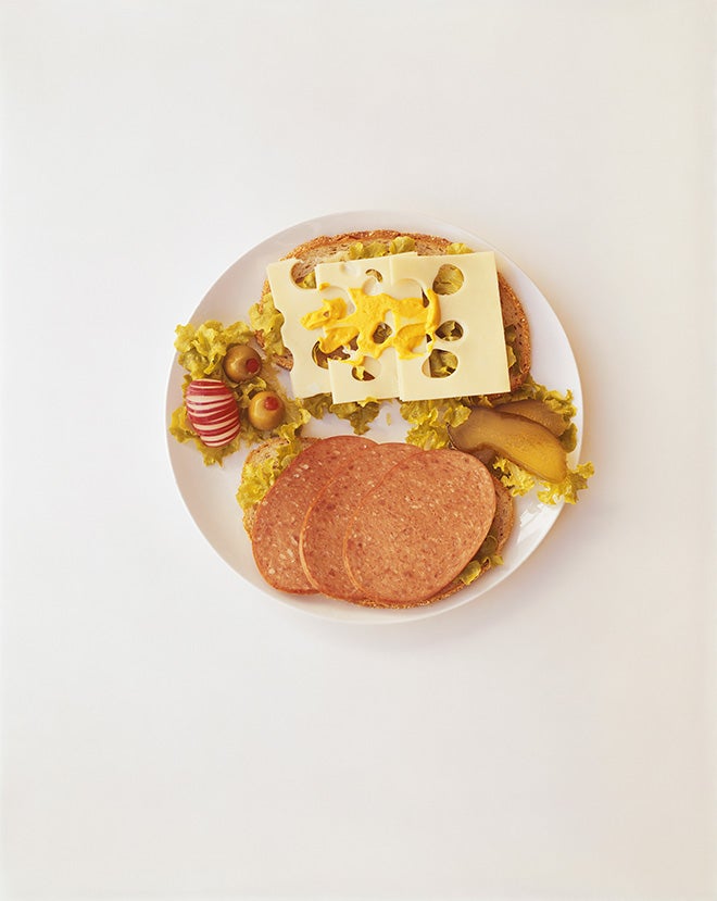 Plate of breakfast with sausage cheese and olive
