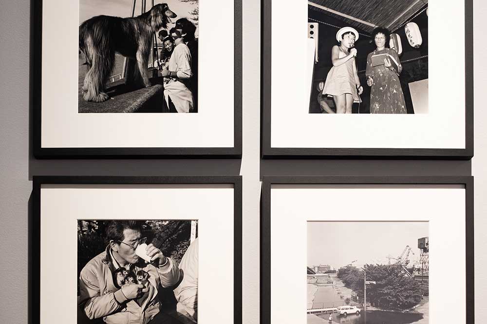four black and white photographs on the wall