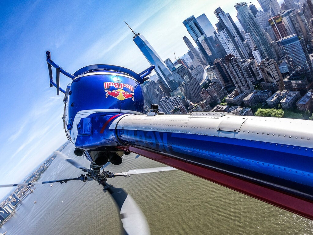 POV shot of red bull helicopter in the midst of one of its aerial maneuvers