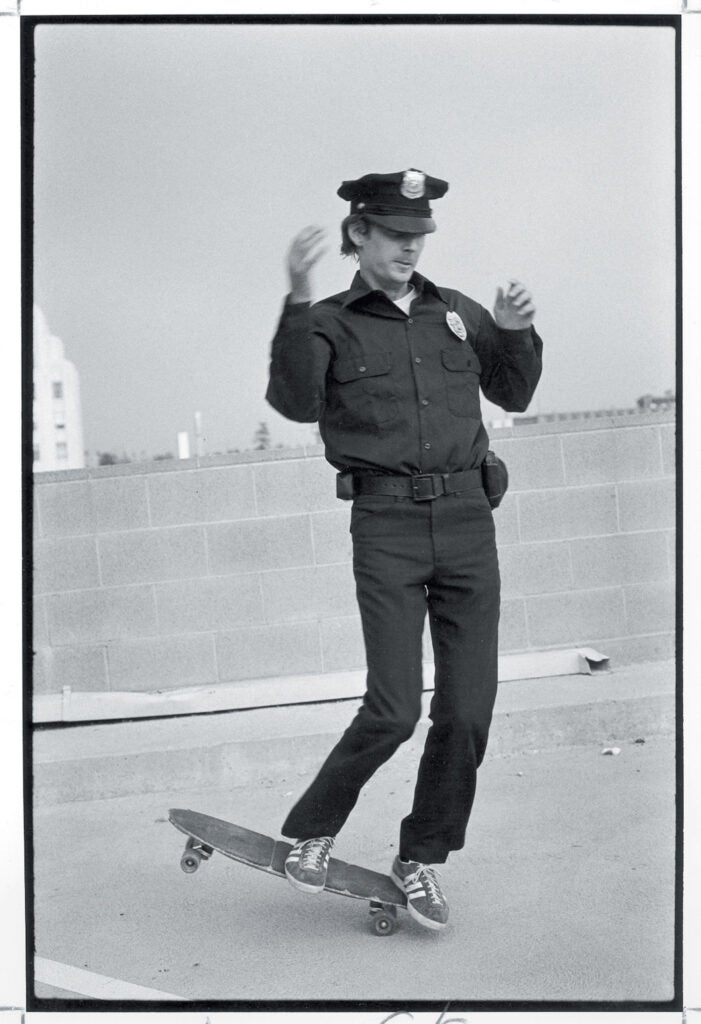 skateboarding policeman