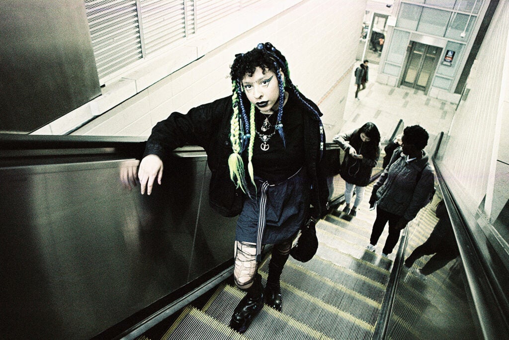 girl ascending escalator