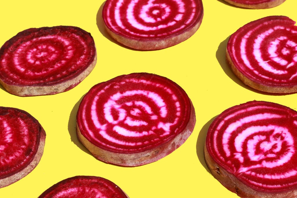 sliced beets on yellow background