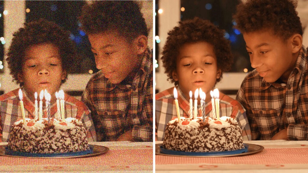 graininess reduced on photo of kids blowing out birthday candles