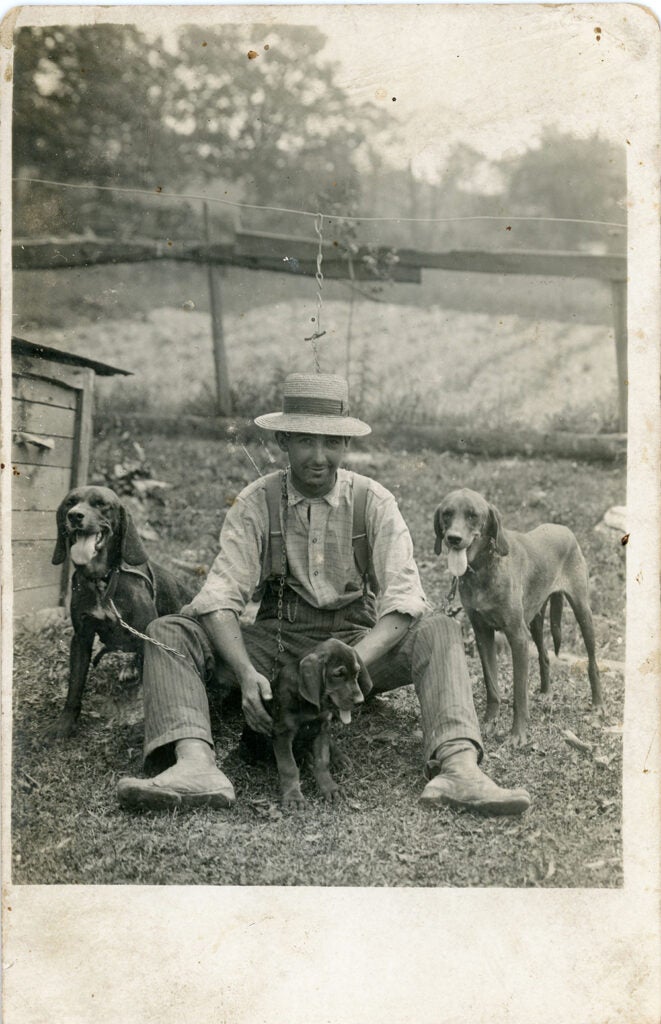 Vintage photo of man with his hounds