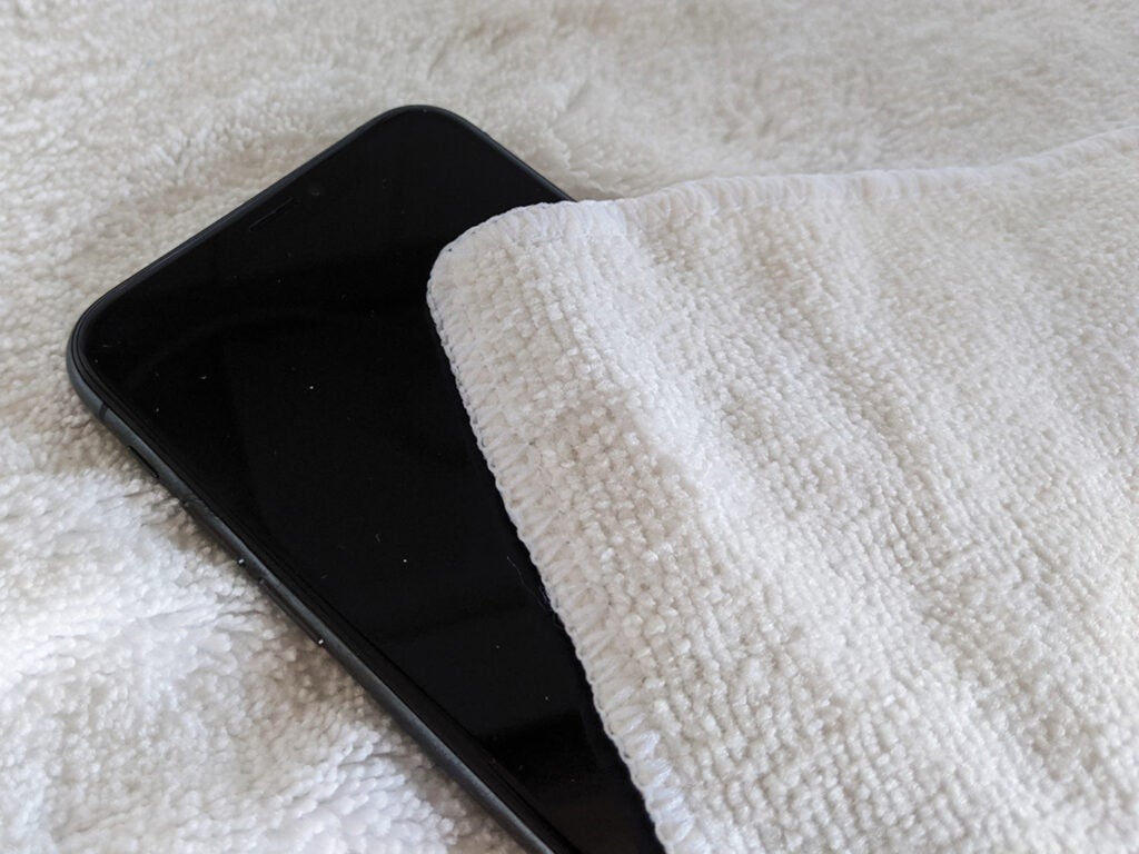 smartphone between two white towels