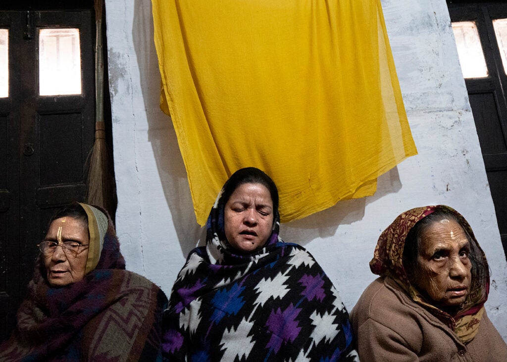 Widows sitting together in Varanasi India