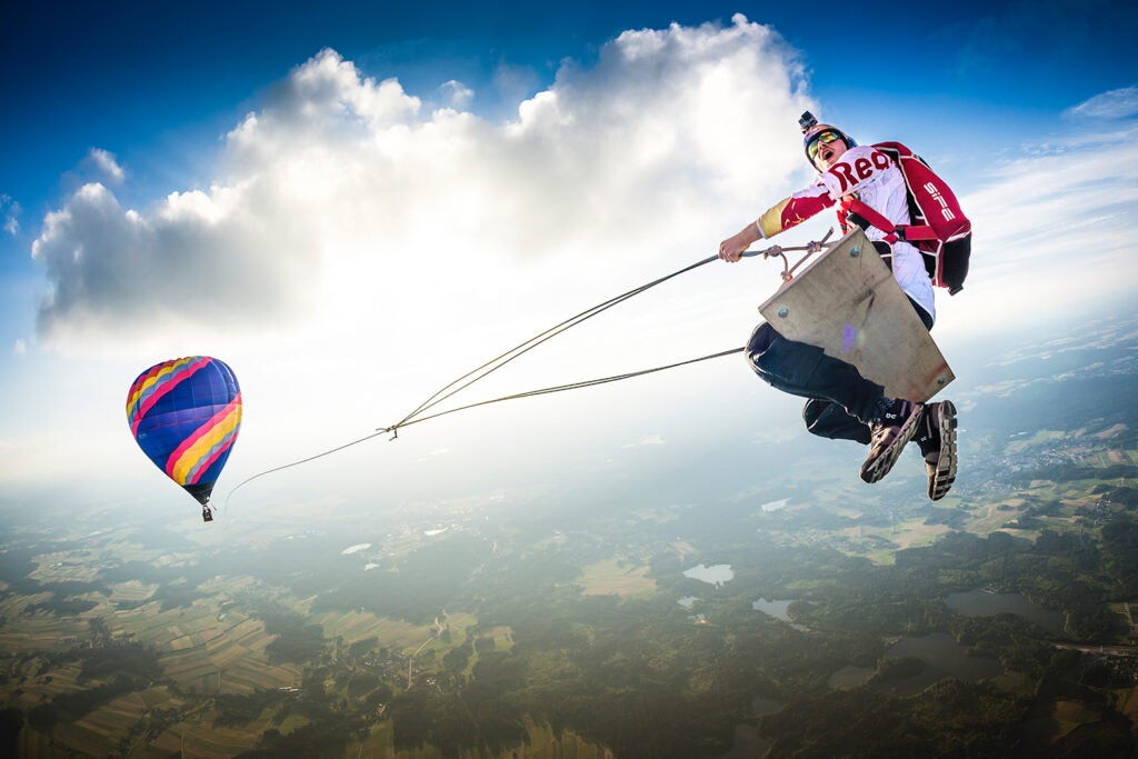 Marco FuÌrst flying on an unthinkable hot air balloon swing