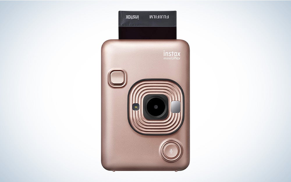A rose gold instant photo camera