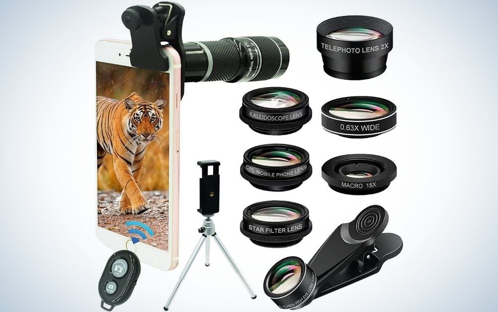 A black smartphone holder, on which stands a leopard shell phone, and several camera lenses lined up.