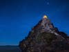 Brightly lit tent at night