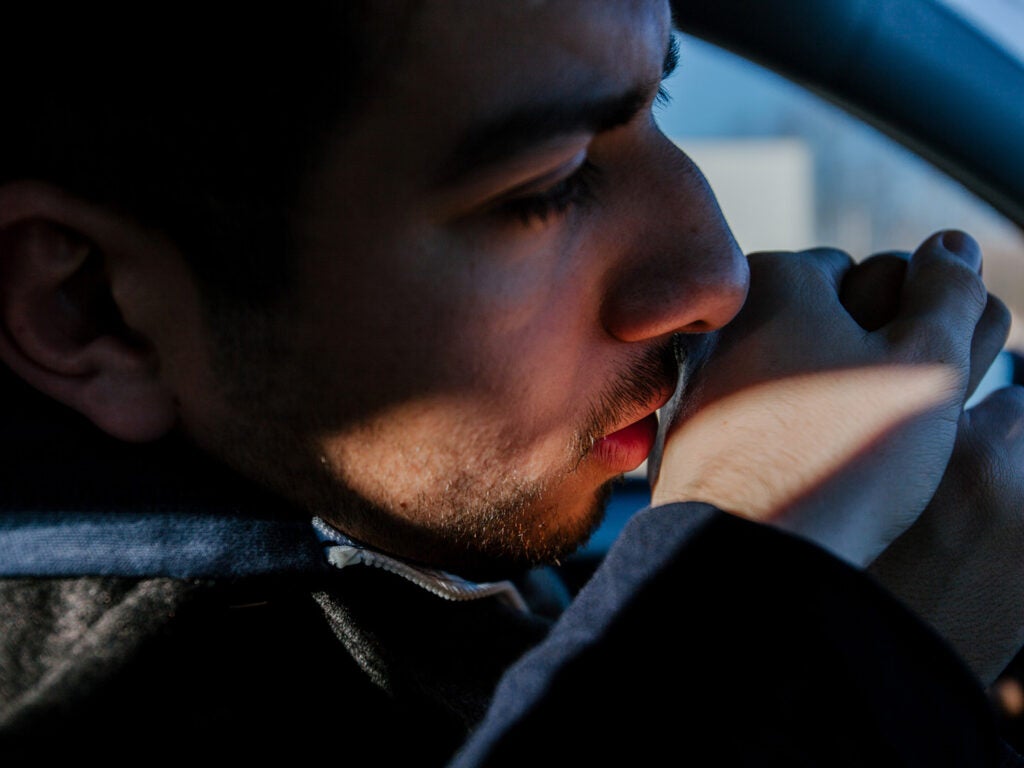 man gently kissing hand