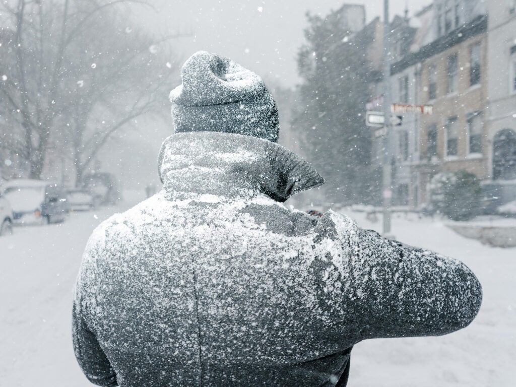 man dusted in snow