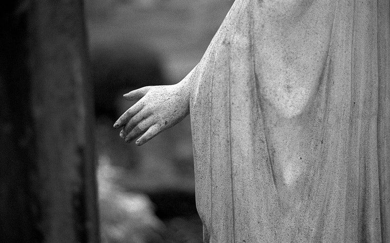 black and white statue hand