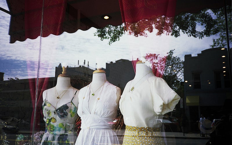 dresses on mannequins in a shop