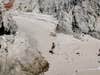 man walking through the snow