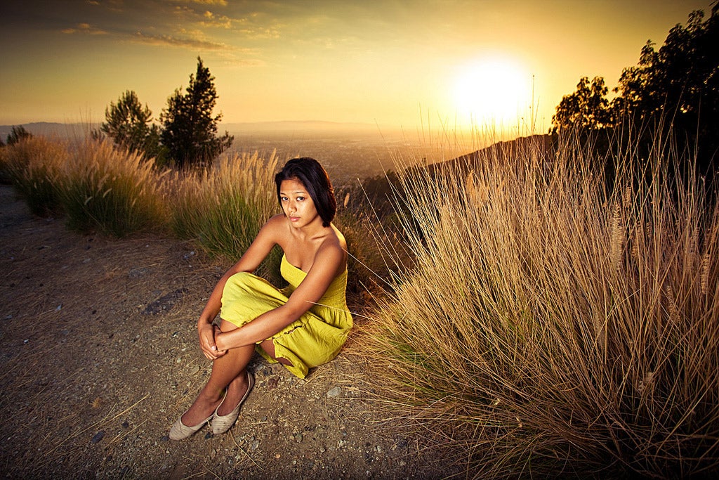 girl against a desert sunset