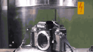 A hydraulic press makes film cameras more compact