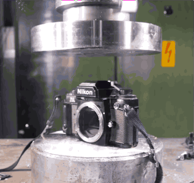 A hydraulic press makes film cameras more compact