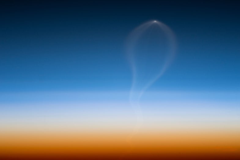Image of an Atlas V rocket launch from the space station
