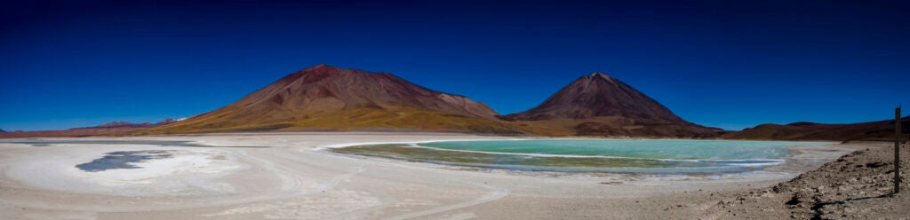 Photo: Navjit Bhamra Magnesium lagoon located on the border between Chile and Bolivia. Large deposits of Borax in the ground. Licancabur volcano can be seen on the right. CAMERA: Nikon D7000