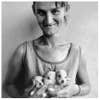 Wife-of-abattoir-worker-holding-three-puppies-Ora