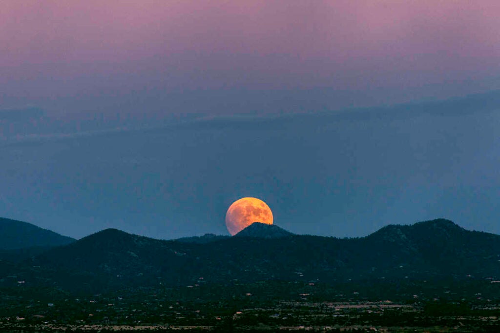 Super Blood Moon Rising Over Santa Fe, NM. Taken With A 5D Mkii - 70-200mm Lens. F8, 1/100s, ISO 640. Very Minimal Editing. All I Did To Edit This Is Bring Up The Contrast A Bit Because The 5D Shoots A Little Flat. The Weather Was Gorgeous And We Got A Clear View Of The Eclipse Through Out Its Cycle.