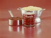 Meatballs, tomato paste can and spaghetti on red background