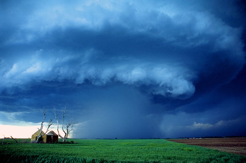 A supercell spins above an abandoned house in north-central Kansas on May 8, 2001. Copyright Chris Kridler, SkyDiary.com