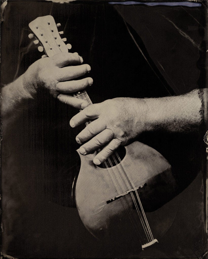 Patrick Shields holding a mandolin