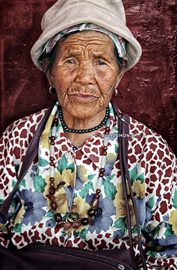 Photo: Christina Itchon Taken in the Philippines, this old lady is a sidewalk vendor who sells traditional homegrown herbs strewn across a flattened cardboard box. The lines on her face convey such deep emotion and the promise of interesting stories. CAMERA: Canon EOS 500D SHUTTER SPEED: 1/100 LENS: Canon EF 24-105mm ISO: 250 APERTURE (F-STOP): ƒ/4.0