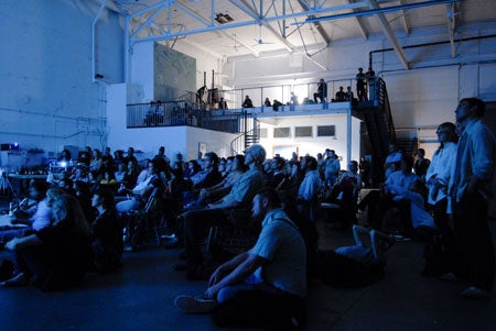 Slideluck-Potshow-Attendees-watch-a-presentation