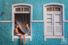 Today's Photo of the Day comes from Davo Muttiah and was taken in Salvador, Brazil with a Canon EOS 5D Mark II and a EF 24-105mm f/4L IS USM lens at 1/400 sec, f/4 and ISO 200. "I was photographing the homes around a neighborhood in Salvador. Then I noticed these two kids sitting out the window," Muttiah writes regarding the image. "Made for a perfect photo." See more work <a href="https://www.flickr.com/photos/muttiah/">here.</a>