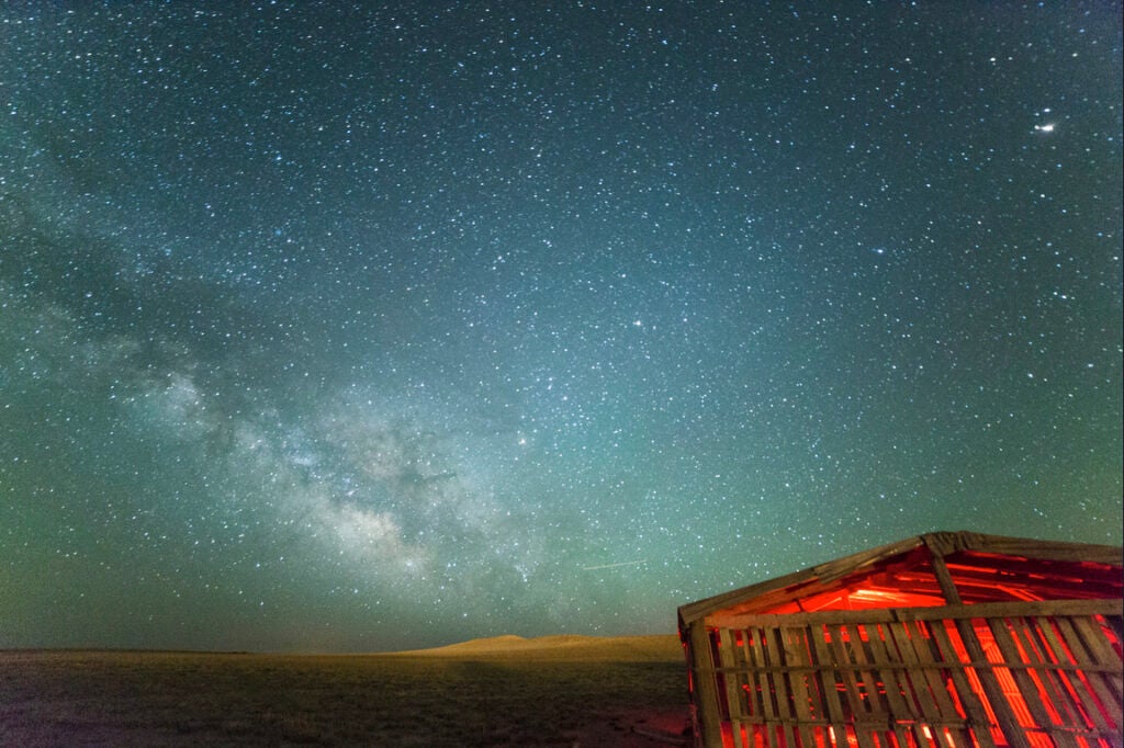 CaptDanger made today's Photo of the Day, a long-exposure of the Milkyway, outside of Estancia New Mexico. <em>"The sky way open and in full display with a bar lit up for accent. A single red light was illuminating the bar made of pallets. A nice calm night to watch the stars and take some amazing pictures! Taken with a Canon 5D Mark III, using a Rokinon 14mm lens, [with an exposure of] ISO 4000, f/2.8 for 30 secs."</em> See more of his work <a href="https://www.flickr.com/photos/captdanger/">here</a>. Want to be featured as our next Photo of the Day? Simply submit you work to our <a href="http://www.flickr.com/groups/1614596@N25/pool/page1">Flickr page</a>.