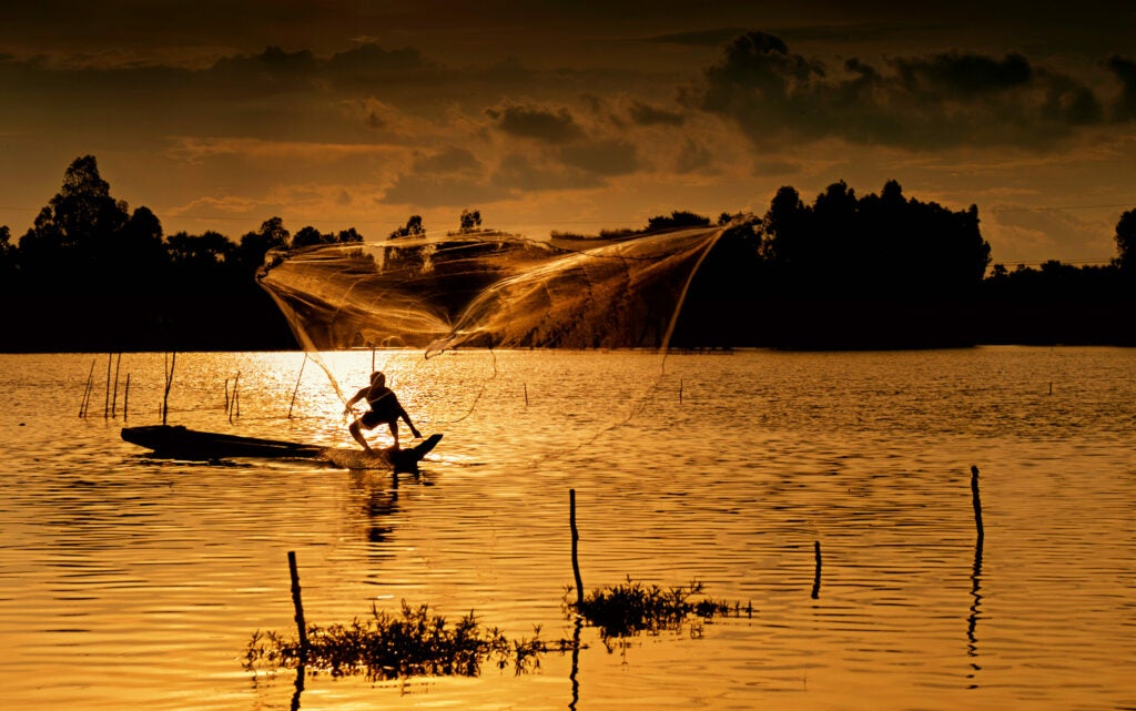 Photo: DUNG TRAN Fishing on River