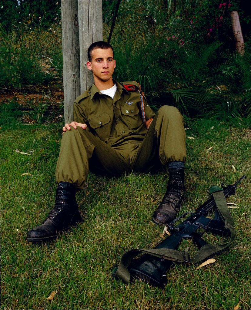 soldier sitting in back yard