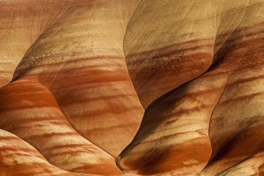 Painted Hills, located In Wheeler County, OR, is an area named after the colorful layers of its hills corresponding to various geological eras, formed when the area was an ancient river floodplain. The colors can vary depending on time of day, weather and season. I made minor adjustments in Camera RAW And Photoshop.