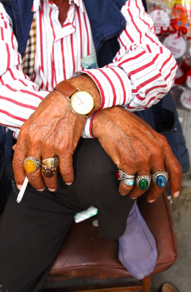 I was walking on the streets of Tehran and noticed this man selling locks on the side of the road. What caught my eye is that someone who seemed to have so little could have such extravagant accessories. The uniqueness of his style and hardworking nature of his hands caught my eye.