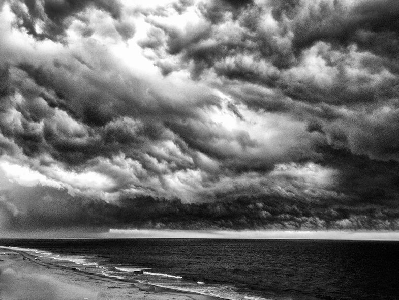 When and where was the photo taken?July 2012 in Margate, NJ.What camera and lens were used? Canon Rebel 2Ti, Canon 18-200 lensTech specs: ISO 400, 1/20 sec, F/8.Description: A raging storm was passing over the ocean and I shot this from a 7th floor balcony as the storm approached. See more of Lynne's work here. Want to see your photo picked as our Photo of the Day? Submit it HERE.