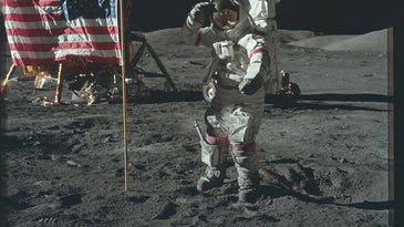 astronaut saluting flag on the moon
