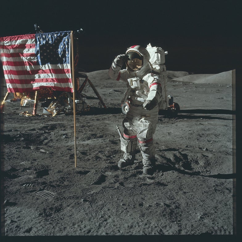 astronaut saluting flag on the moon