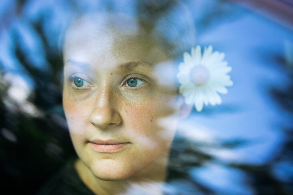 A stylized portrait shot through a car window. The focus hits the front eye and the sharpness wide open is very impressive. You can clearly see the edge of her contact lens in the full-res version. Achieving focus, however, in this situation was pretty tricky and required some manual tweaking thanks to the reflections.