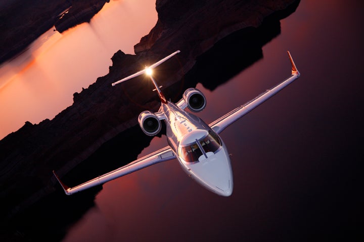 A Learjet is shot from the open tail of a B-25 bomber over Lake Powell.